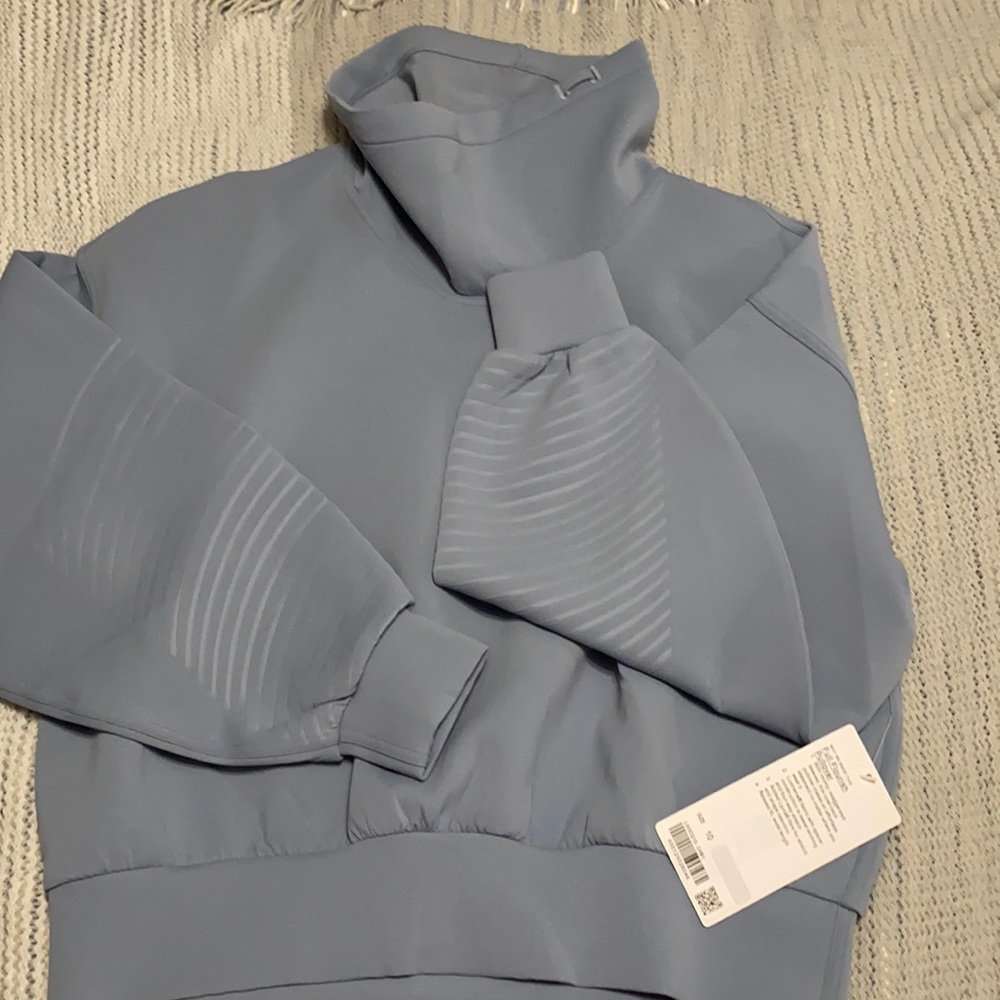 Lululemon Full Flourish Pullover. Brand new with tags, never worn size 10.